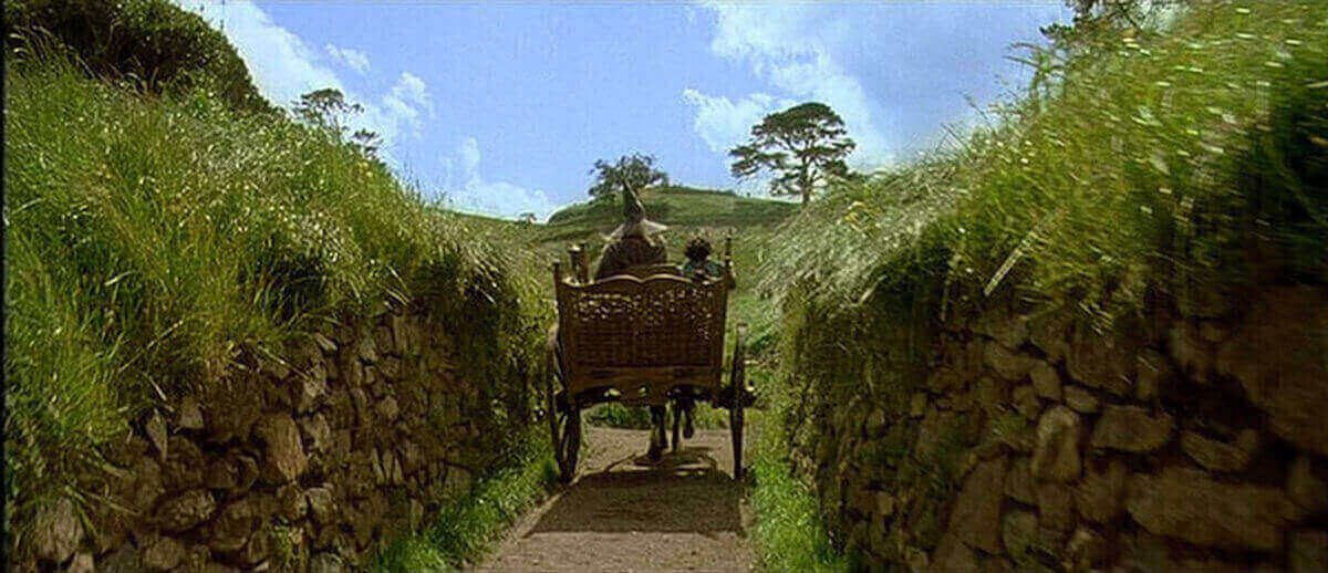 image gandalf entering hobbiton from the lord or rings movie